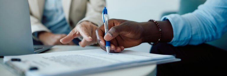 Defense contractors reviewing CMMC enforcement 2025 compliance requirements and SPRS affirmation documentation